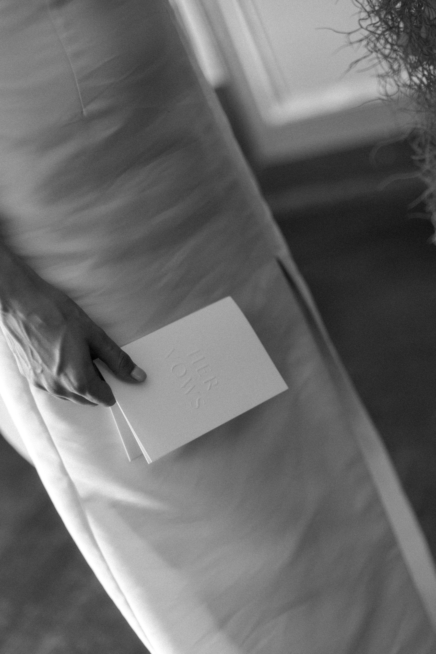 Bride holding Vow Booklet